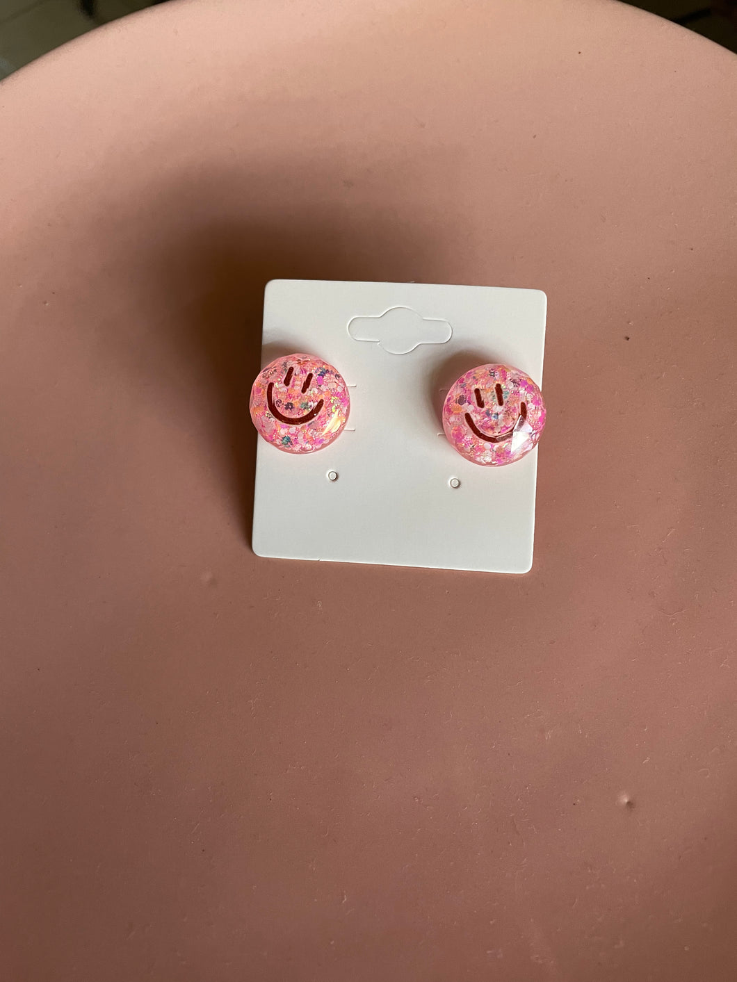 Happy face studs